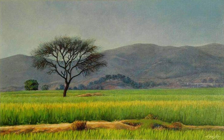 Landscape painting of a lone bare-branched tree standing in a vibrant green and yellow mustard field with mountains behind.